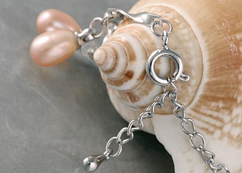 Silberarmband (Spirale) mit echten Süßwasserzuchtperlen Perlen oval ca. 6-8mm - Orange -